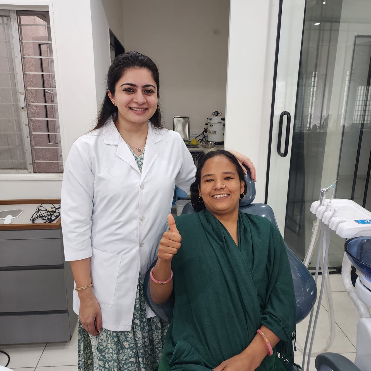 Happy patient giving thumbs up